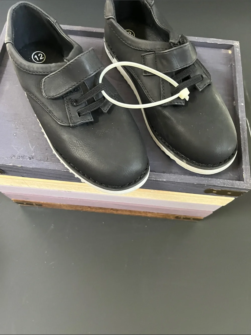 Black faux leather sneakers